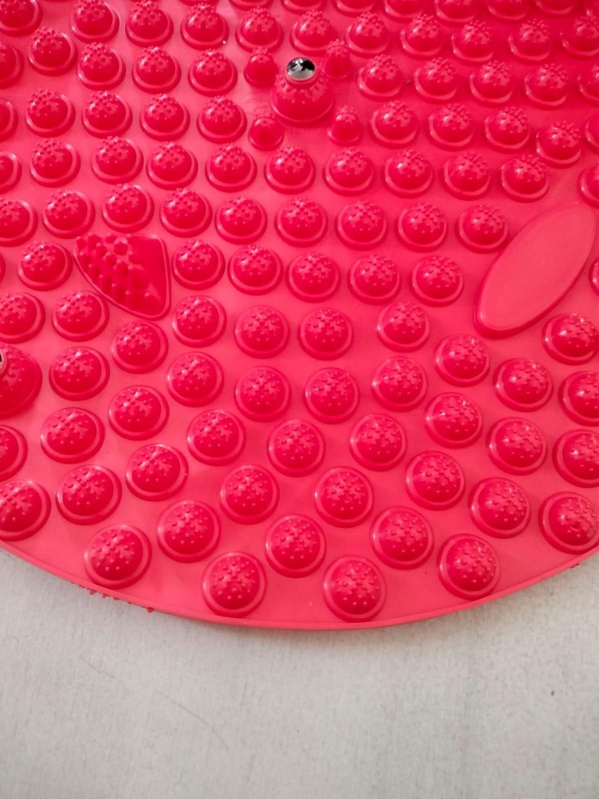 Red silicone foot massage pad with raised textured nodes for effective foot reflexology and comfort