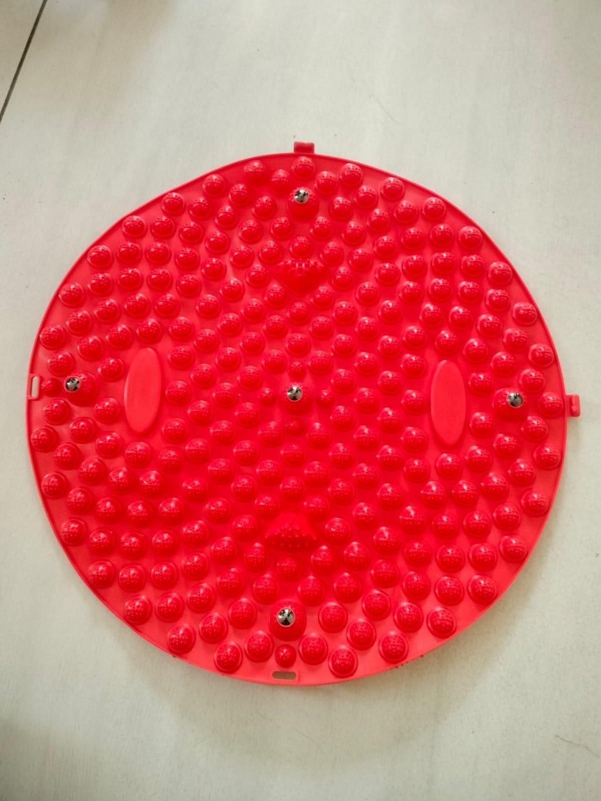 Red silicone foot massage pad with raised nodes for stimulating pressure points and improving circulation