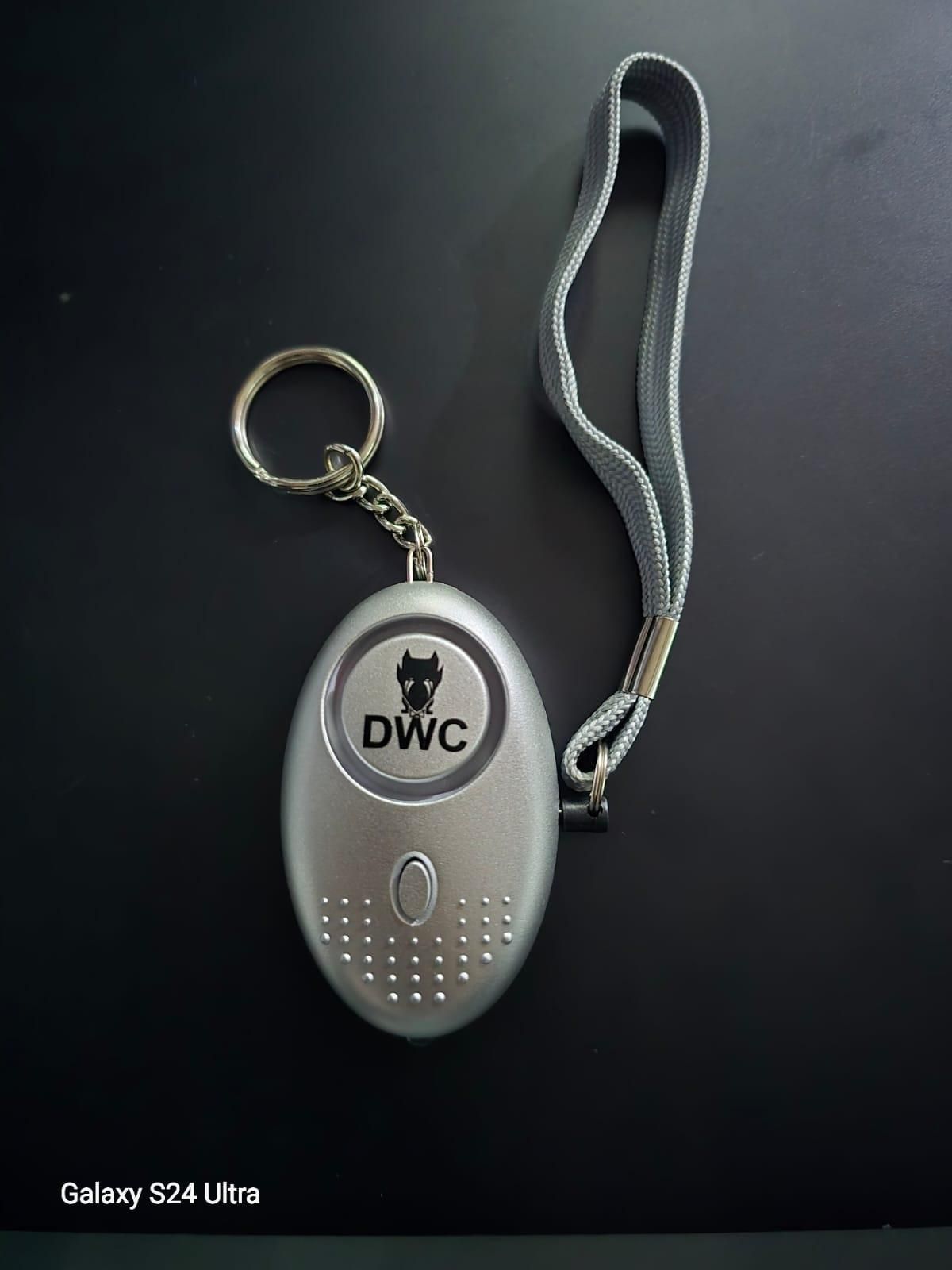 Silver emergency safety keyring with wrist strap and DWC logo on black background