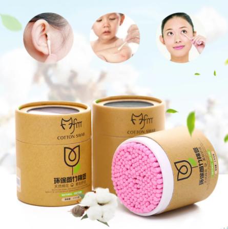Soft wood stick cotton swabs in eco-friendly brown packaging with pink tips for gentle use