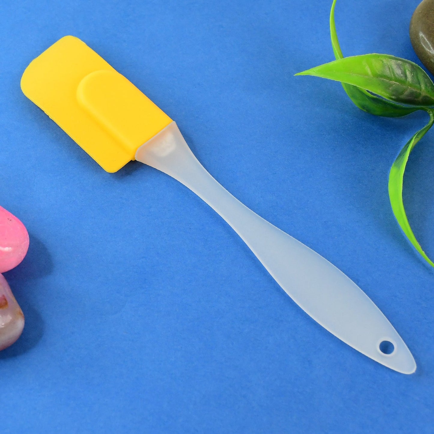 Flexible silicone spatula with a yellow head ideal for cooking and baking by Your Brand