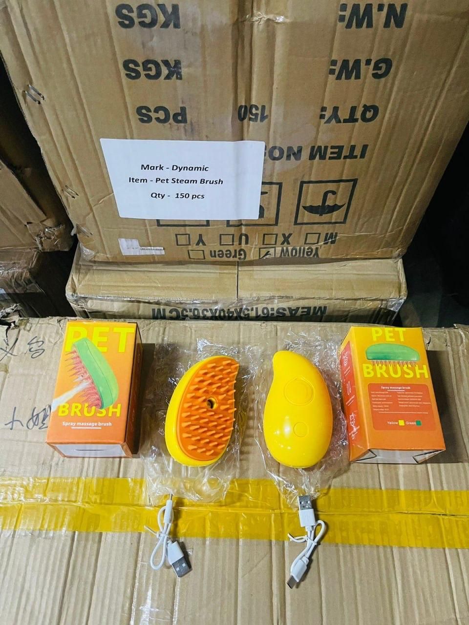 Steaming pet hairbrush in yellow with ergonomic design and included charging cable for easy grooming
