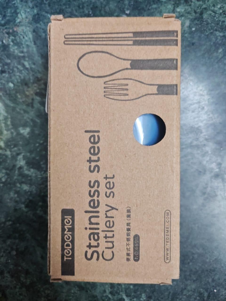Travel cutlery set in cardboard packaging with stainless steel spoon, fork, and chopsticks design