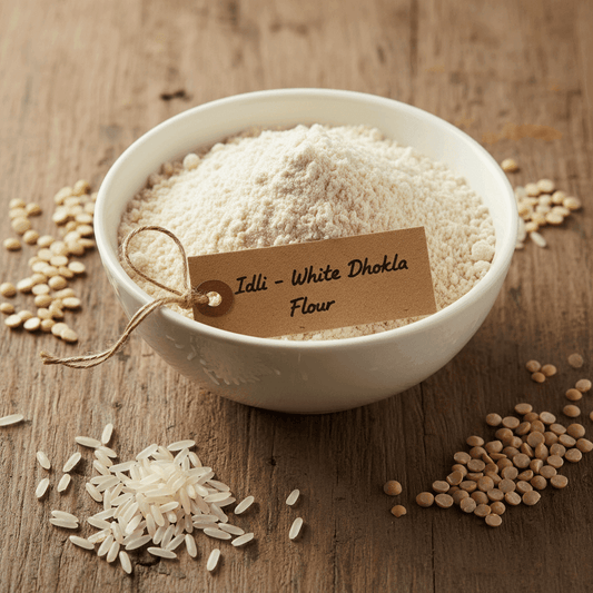 Organic Idli & White Dhokla Flour in a white bowl with rice and lentils on a wooden surface