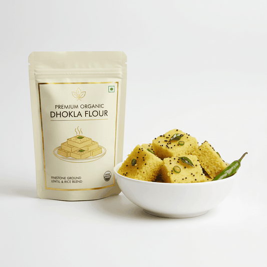 Premium Organic Handva & Yellow Dhokla Flour in a resealable bag with fresh dhokla pieces in a bowl