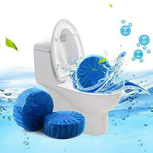 Toilet cleaning tablets by THE GIR FARMER with blue color shown inside and next to a white toilet bowl