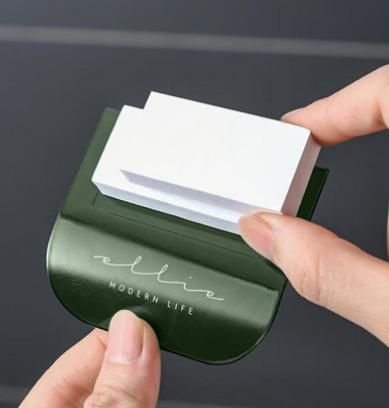 THE GIR FARMER touch free toilet seat lifter with modern green and white design held by hands