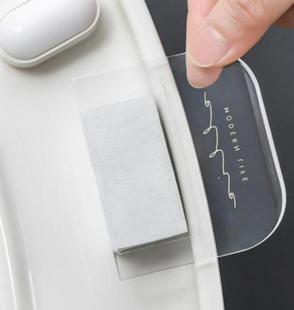 THE GIR FARMER transparent touch free toilet seat lifter being peeled off for sanitary use