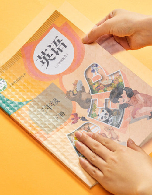 Transparent book cover pack displayed on a textbook for protection and preservation