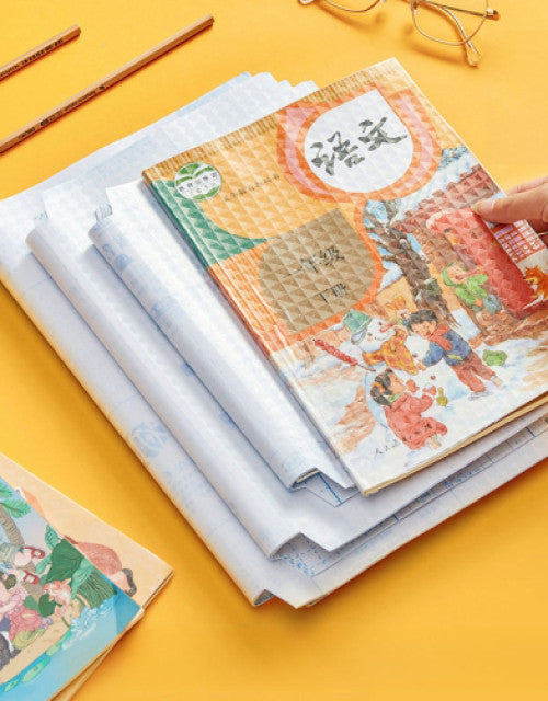 Transparent book cover pack protecting colorful illustrated books stacked on a yellow background