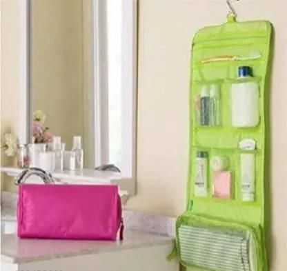THE GIR FARMER green travel makeup organizer bag hanging with multiple compartments for toiletries