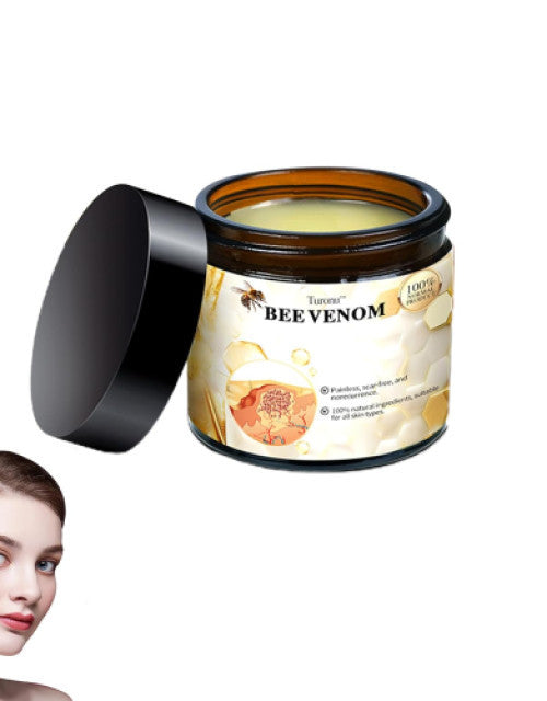 The Gir Farmer bee venom cream for acne scars in a brown jar with black lid and smooth texture