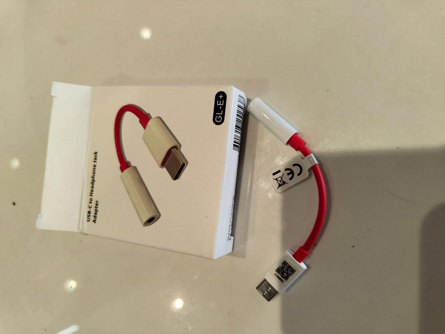THE GIR FARMER Type C to 3.5mm audio adapter in red with packaging for connecting headphones
