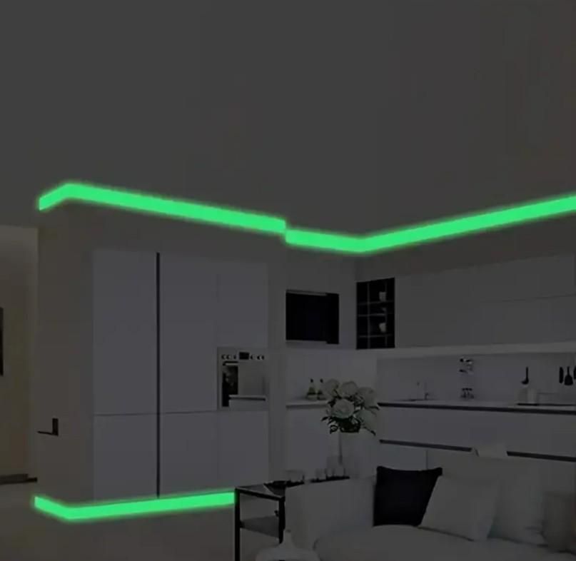 Glow in the dark safety tape outlining kitchen ceiling and base for enhanced night visibility