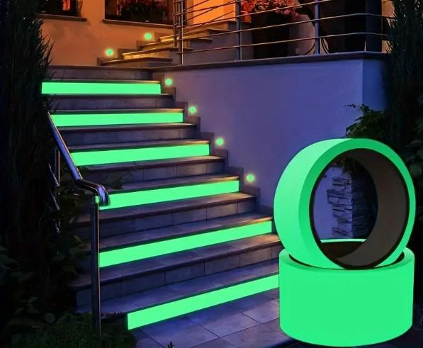 Glow in the dark safety tape applied on outdoor stair edges and stacked rolls by The Gir Farmer