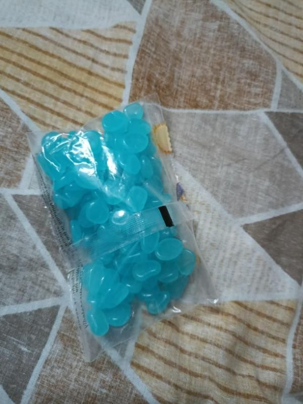 Pack of blue mixed color glow stones for pathways in clear plastic packaging by THE GIR FARMER