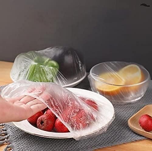 Reusable elastic plastic bags for food covering bowls and plates with fruits and vegetables