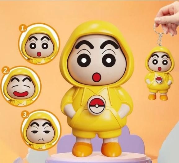 Shinchan face changing keychain with three different facial expressions wearing a yellow hoodie by THE GIR FARMER