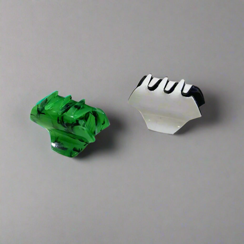 Gir Farmer small hair claw clips for women in green and silver colors on gray background