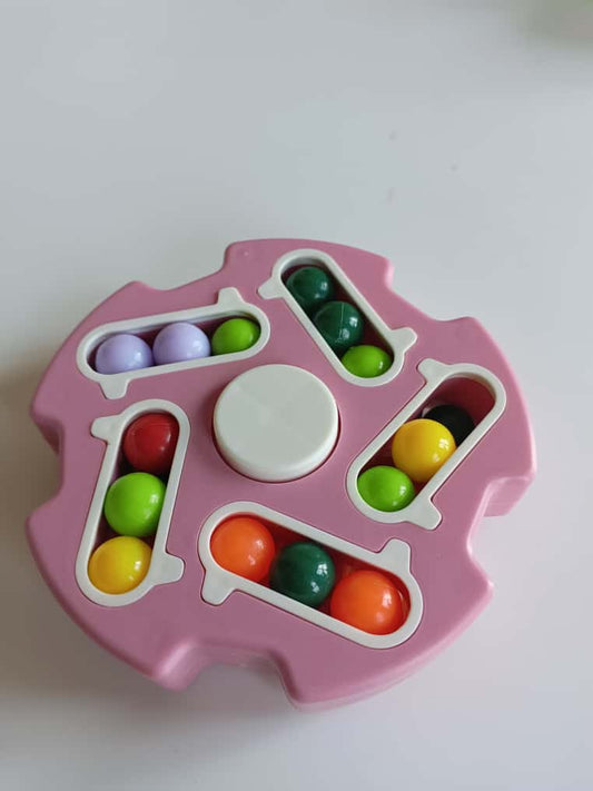 Colorful pink wheel spinner toy with vibrant beads for kids' fun and engagement