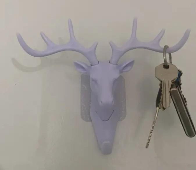 The Gir Farmer white deer head self adhesive coat hook mounted on wall holding keys