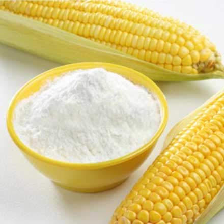 THE GIR FARMER organic corn flour online in a yellow bowl next to fresh corn cobs