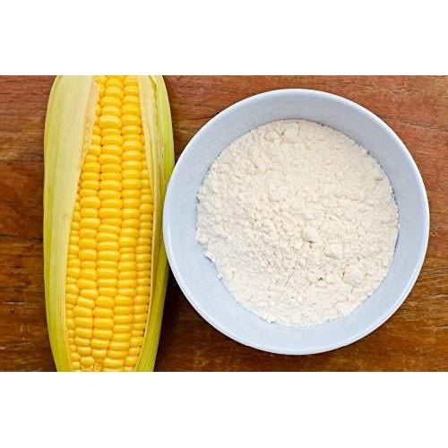 THE GIR FARMER Organic Corn Flour Online in a bowl next to fresh corn for healthy cooking
