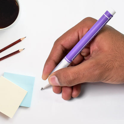 Hand holding a Your Brand 0.5 mm black ball pen over sticky notes and a coffee cup
