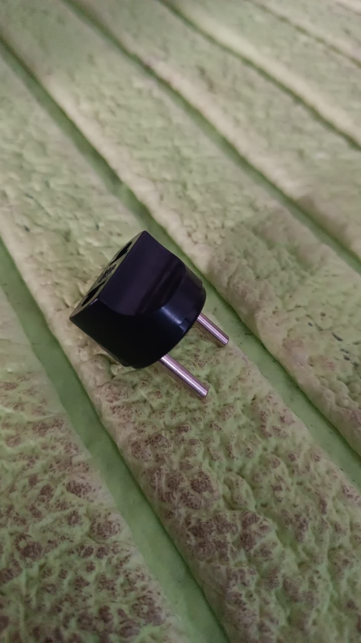 Compact 2 pin plug adapter for international power compatibility and travel convenience