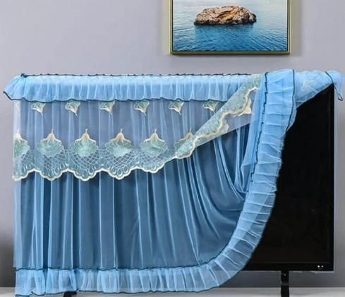 Elegant blue 28-32 inch TV dustproof cover with lace detailing and ruffled design
