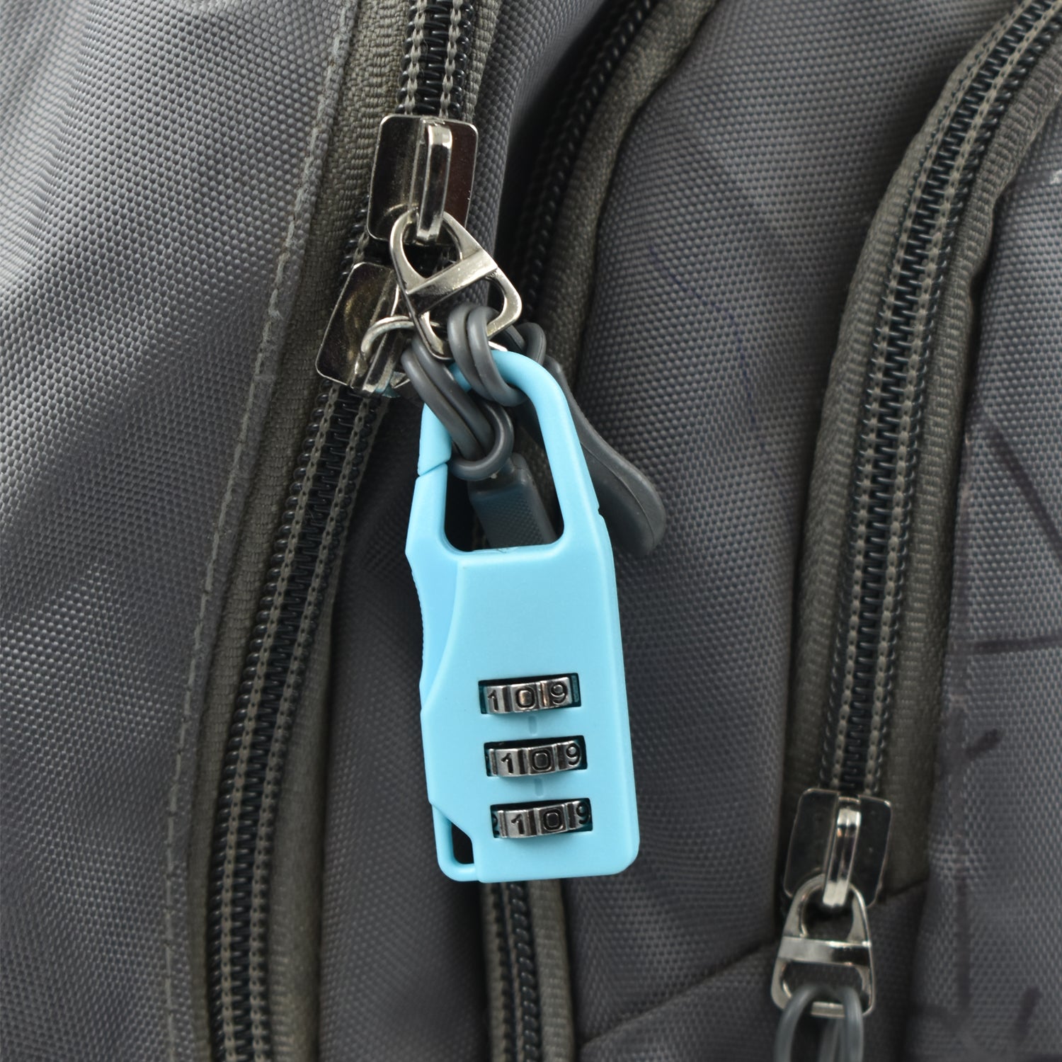 3 digit luggage lock in blue color secured on a travel bag zipper for enhanced security