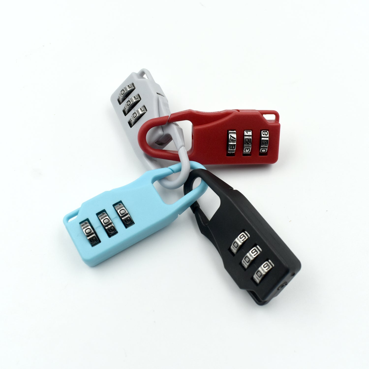 Set of three 3 digit luggage locks in red, blue, and black for secure travel protection