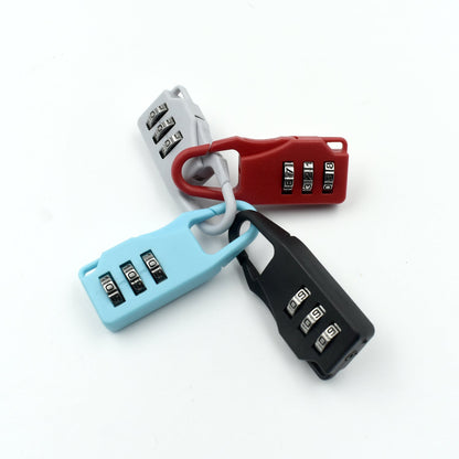 Set of three 3 digit luggage locks in red, blue, and black for secure travel protection