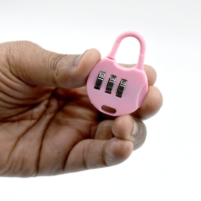 Pink 3 digit zipper lock held in hand, ideal for securing bags and luggage