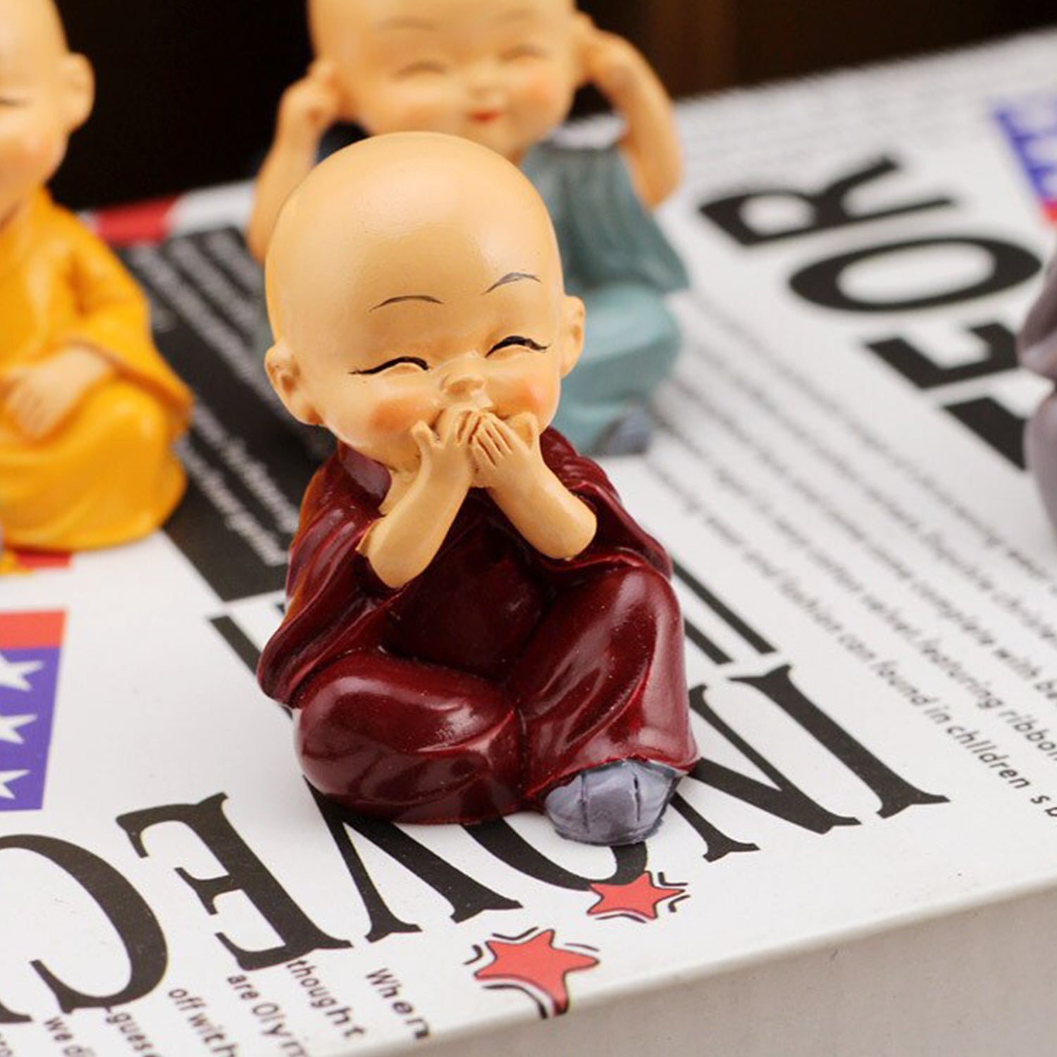 Baby Buddha showpiece set featuring cheerful, colorful monk figurines sitting and smiling