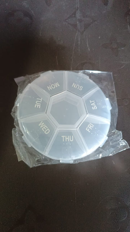 Clear plastic 7 day pill organizer with daily compartments for easy medication management
