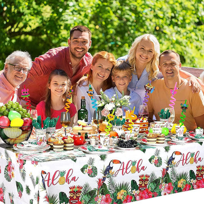 Family gathering around a festive table with colorful decorations and reusable plastic drinking straws