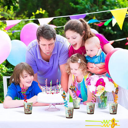 Colorful reusable plastic drinking straws in festive cups during a birthday celebration with family