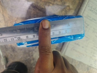 Measuring adhesive fabric fusion tape package with a ruler for precise size reference