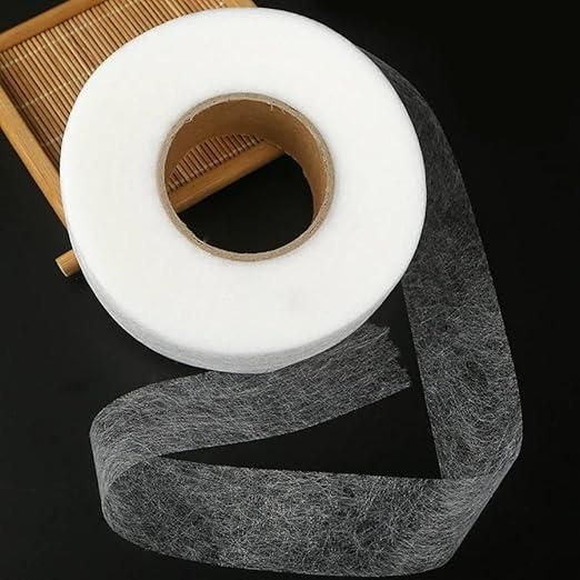 Roll of adhesive fabric fusion tape for seamless fabric bonding and quick repairs
