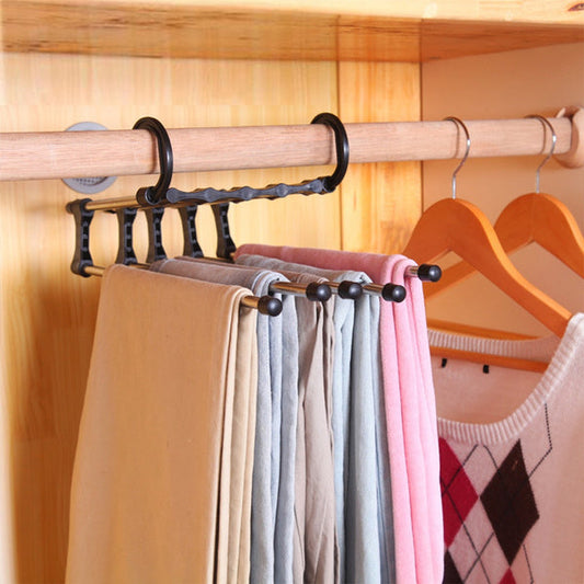 Adjustable trouser hanger organizer holding multiple pants for efficient closet storage
