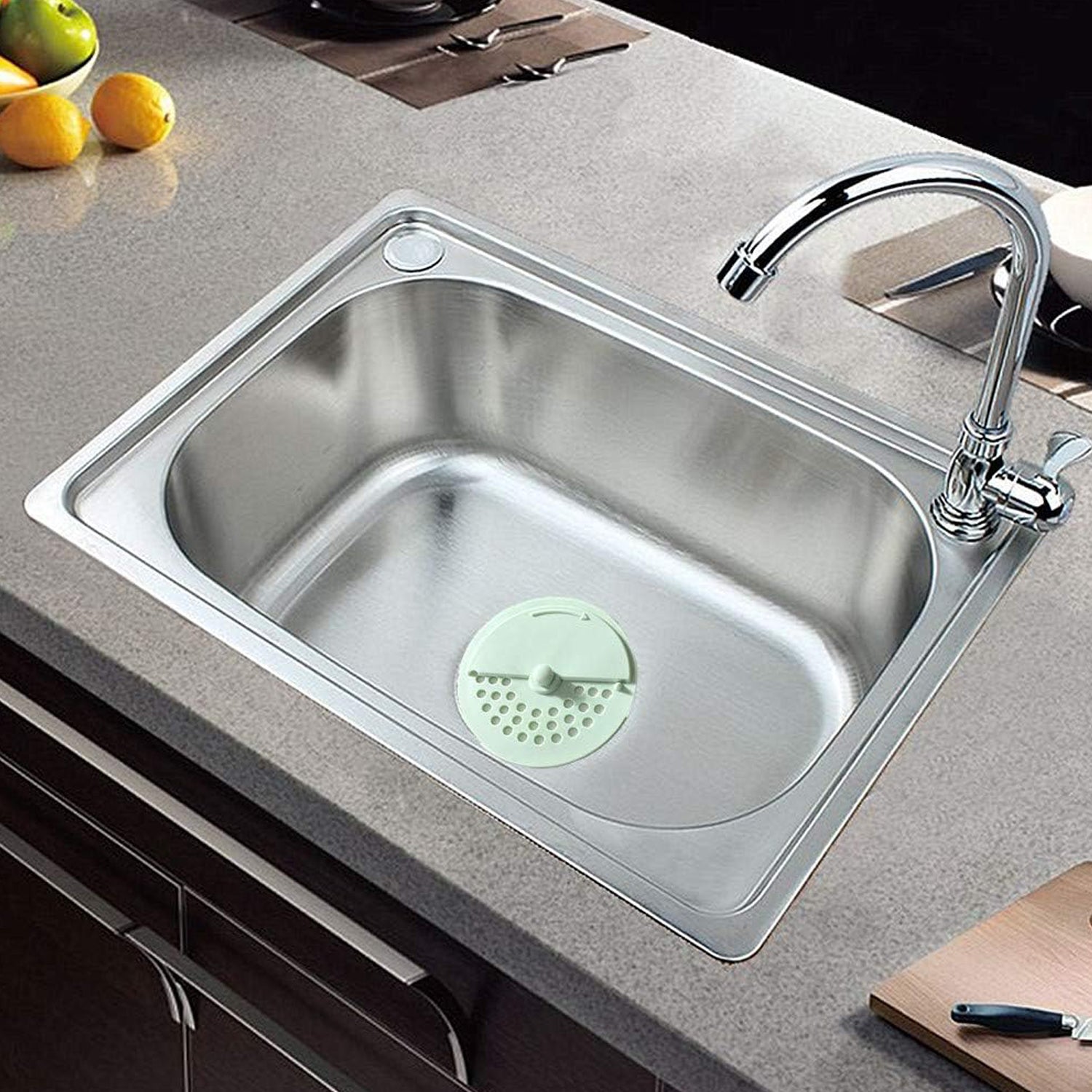 Your Brand anti-odor round drain cover in a modern stainless steel kitchen sink