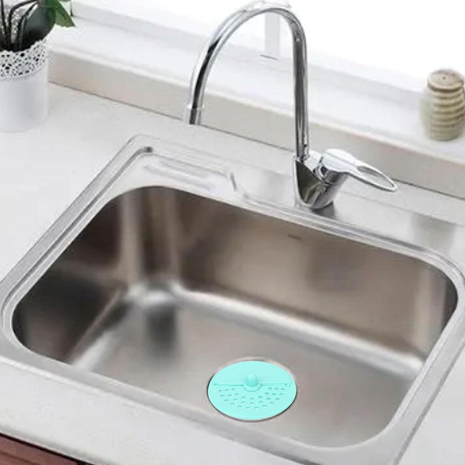 Your Brand anti-odor round drain cover placed in a stainless steel sink for effective odor control