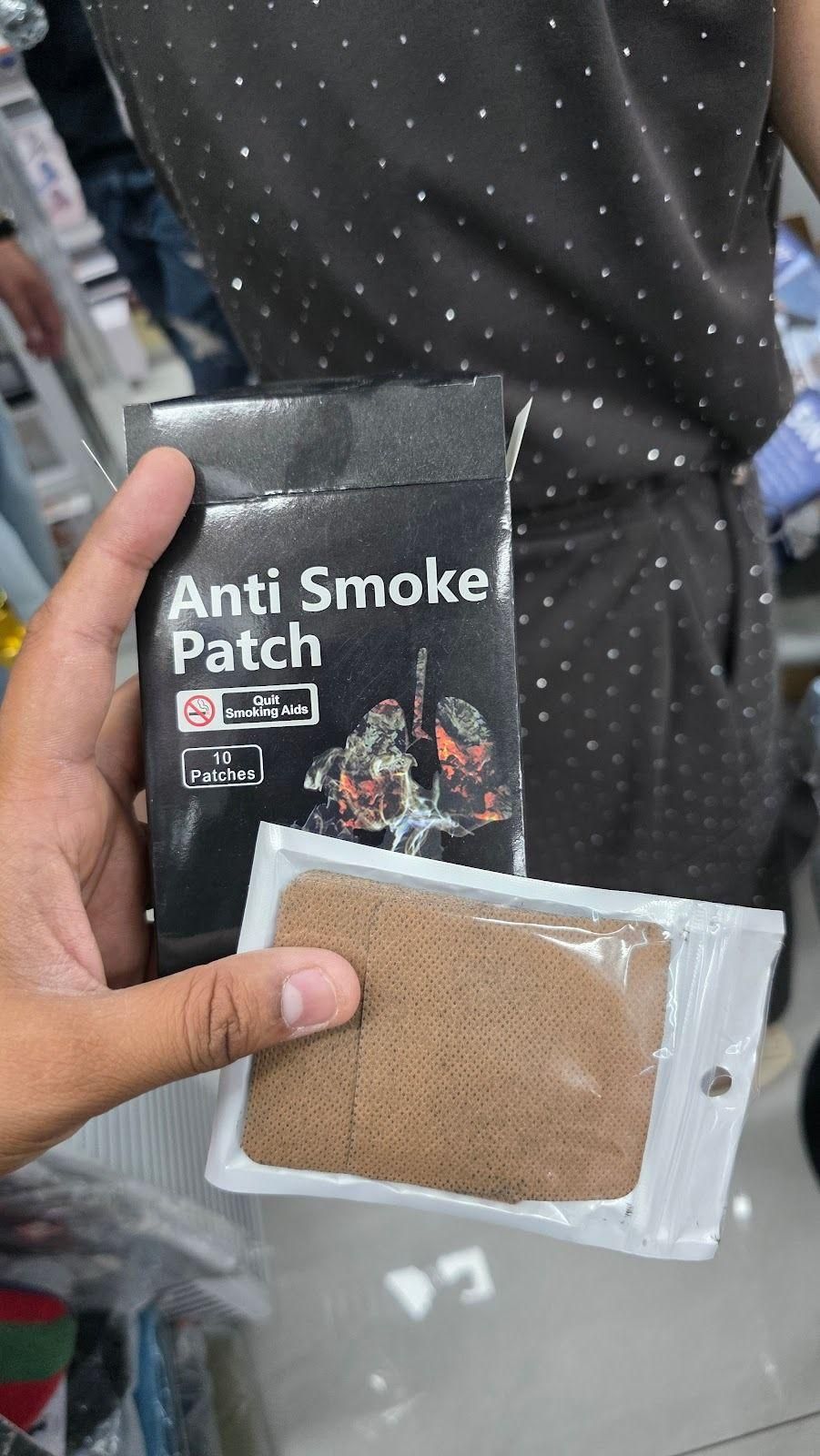 Anti Smoke Patch for quitting smoking in hand, packaging shows 10 patches for effective smoking cessation