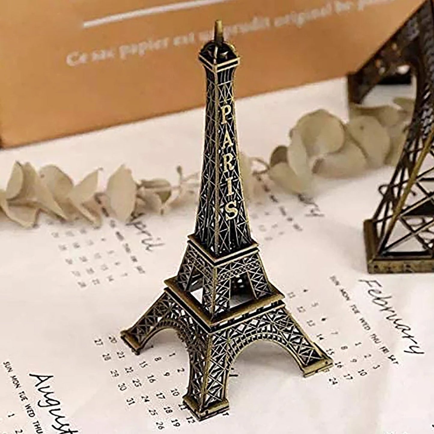 Antique Eiffel Tower statue in detailed design, perfect for home decor enthusiasts