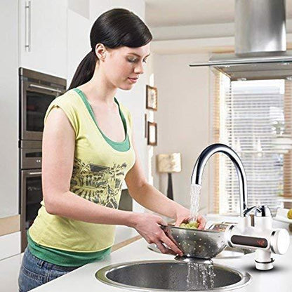THE GIR FARMER instant electric water heater faucet on kitchen sink with woman rinsing vegetables