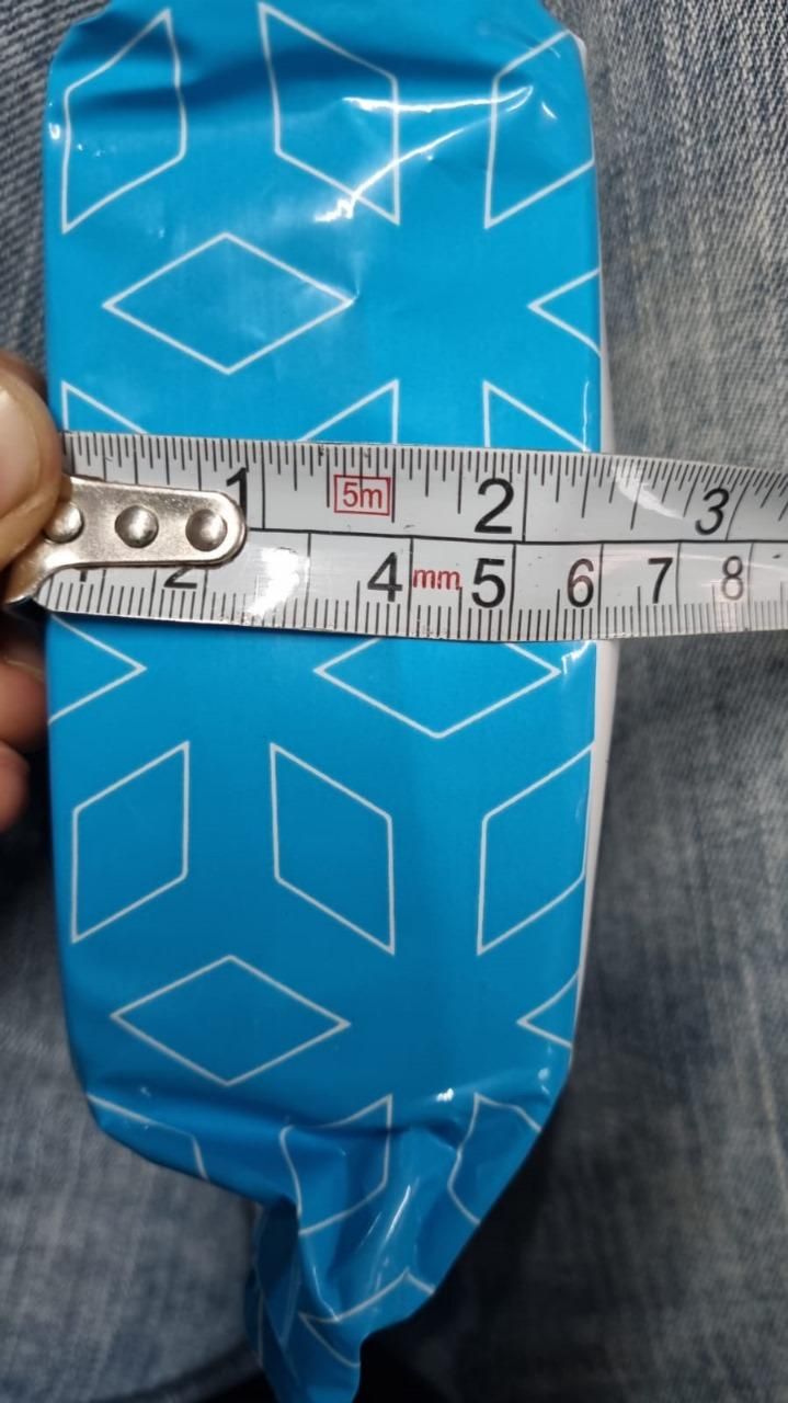 Artistic hand face vase for home decor with a blue geometric pattern and measuring tape for size reference