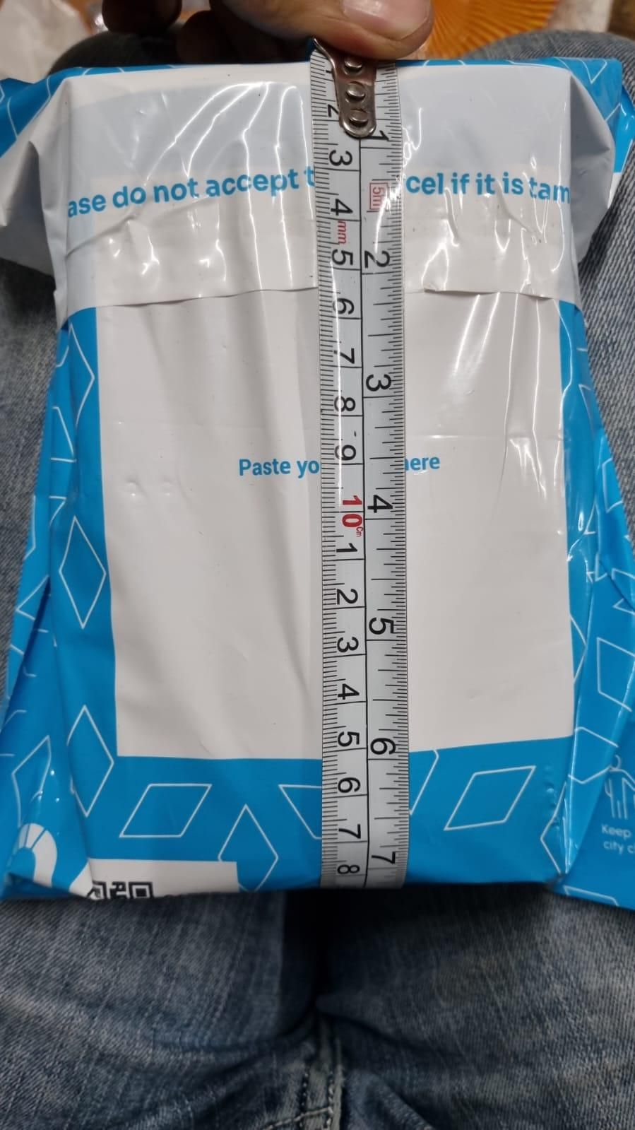 Wrapped package containing an artistic hand face vase for home decor, measuring approximately 10 inches
