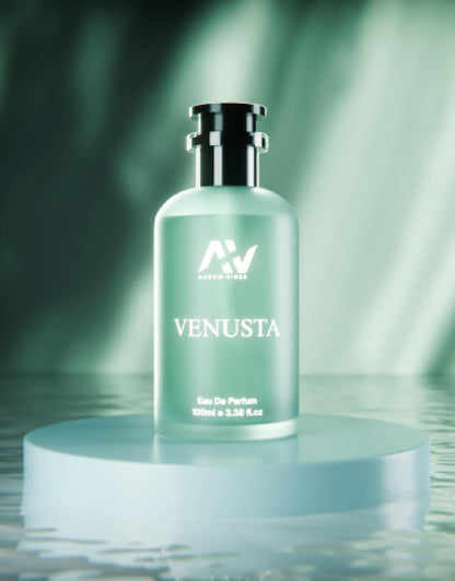 Venusta perfume 100ml Eau De Parfum in a frosted glass bottle with silver cap on a round platform