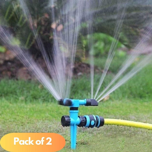 THE GIR FARMER automatic rotating yard sprinkler in blue spraying water evenly over green grass